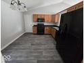 Spacious kitchen with matching black appliances, durable floors and ample cabinet space at 5825 Sapelo Dr, Indianapolis, IN 46237