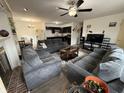 A cozy living room offers a spacious seating area, an open floor plan, and neutral décor at 5941 Deerwood Ct, Indianapolis, IN 46254