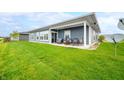 Relaxing back porch with outdoor seating, ideal for enjoying the backyard view at 655 N Sobota Way, Trafalgar, IN 46181