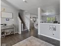 Inviting entryway with hardwood floors, staircase, and stylish decor at 6608 Sonesta Dr, Indianapolis, IN 46217