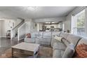 Comfortable living room showcasing a large sectional sofa and open layout to the kitchen at 6608 Sonesta Dr, Indianapolis, IN 46217