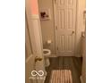 Cozy half bathroom with wood-style floors at 6730 Nw Shanghai Cir, Indianapolis, IN 46268