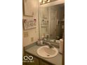 Well-lit bathroom with a functional sink and neutral decor at 6730 Nw Shanghai Cir, Indianapolis, IN 46268