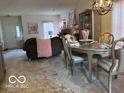 Open-concept living and dining area with ample space for entertaining guests at 6730 Nw Shanghai Cir, Indianapolis, IN 46268