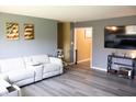 Cozy living room featuring a plush sofa, modern décor, and a wall-mounted television at 6801 Shalimar Ct, Indianapolis, IN 46214