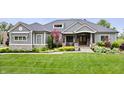Charming home with lush green lawn, professional landscaping and a three-car garage at 780 Chatham Hills Blvd, Westfield, IN 46074
