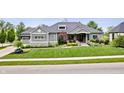 Charming home with lush lawn, professional landscaping and a three-car garage at 780 Chatham Hills Blvd, Westfield, IN 46074