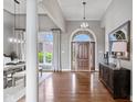 Spacious foyer boasts gleaming hardwood floors and natural light, creating an elegant entrance to the home at 11761 Darsley Dr, Fishers, IN 46037