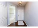 Bright foyer with hardwood floors and fresh paint, leading to other rooms in the home at 12820 Gloria Dr, Fishers, IN 46037
