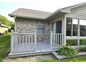 Cozy rear deck with access to sunroom, perfect for outdoor relaxation at 1311 Aaron Dr, Shelbyville, IN 46176