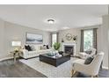 Bright and inviting living room with a fireplace, stylish decor, and ample seating at 1343 Turfway Dr, Avon, IN 46123