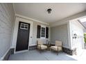 Inviting front porch with seating, offering a cozy spot to relax and enjoy the outdoors at 1590 Birchfield Dr, Westfield, IN 46074