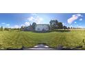 Expansive backyard with a well-maintained lawn, trees, and fenced perimeter offering a private outdoor space at 2211 Willowview Dr, Indianapolis, IN 46239