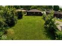 This is an aerial view of the backyard of this property which features a large grassy lawn at 3922 N Irvington Ave, Indianapolis, IN 46226