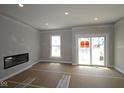 Bright living room with fireplace, large window and sliding door to deck at 4151 Barrel Ln, Westfield, IN 46062