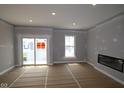 Spacious living room with a fireplace and sliding door to a balcony at 4171 Barrel Ln, Westfield, IN 46062