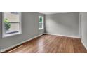 Bright bedroom with hardwood floors and large windows, offering plenty of natural light at 4708 Haverford Ave, Indianapolis, IN 46205