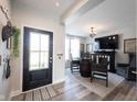 Welcoming living room with a front door, a table set, and lots of light at 4992 Fennel Dr, Pittsboro, IN 46167