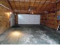 Spacious two car garage with concrete flooring at 509 Eberhart Dr, Shelbyville, IN 46176
