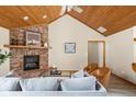 Comfortable living room featuring a brick fireplace and cozy seating arrangement at 5695 N Red Oak Dr, Greenfield, IN 46140