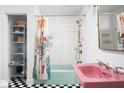 Quirky bathroom with modern fixtures, a unique shower curtain, and black and white tile at 6464 Whitley Ln, Indianapolis, IN 46260