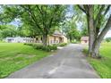 Lovely home with a long driveway and a spacious yard at 6644 Mcfarland Rd, Indianapolis, IN 46227
