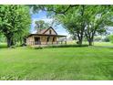 Attractive single-Gathering home with a lovely front yard and covered porch at 6644 Mcfarland Rd, Indianapolis, IN 46227