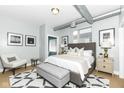 Comfortable main bedroom with neutral tones, stylish decor, and plenty of natural light at 721 E North St # 2C, Indianapolis, IN 46202