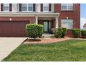 A classic home featuring an inviting front porch and lovely landscaping at 10312 Gladeview Dr, Indianapolis, IN 46239