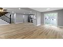 Spacious living room with hardwood floors and sliding door access at 10398 Ethel St, Carmel, IN 46280