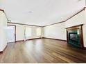 Spacious living room featuring new flooring, fireplace, and classic trim at 10900 Clear Spring Dr, Camby, IN 46113