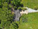 An aerial view showcases the property's sprawling landscape and tree coverage at 11603 Maze Rd, Indianapolis, IN 46259
