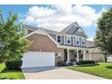 Beautiful two-story home with brick and siding, attached garage, and well-maintained landscaping at 123 Bentree Blvd, Danville, IN 46122