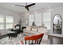 Inviting living room with neutral tones, plush seating, and abundant natural light at 13616 Whitten N Dr, Fishers, IN 46037