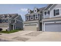 Charming home featuring a spacious two-car garage, manicured lawn, and inviting curb appeal at 14110 Bay Willow Dr, Fishers, IN 46037
