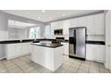 Bright kitchen with white cabinets, stainless steel appliances, and a breakfast bar at 4810 Crystal River Ct, Indianapolis, IN 46240