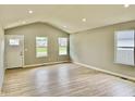 Living room featuring high ceilings, recessed lighting and luxury vinyl plank flooring at 5 Watson Dr, Trafalgar, IN 46181