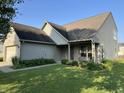 Charming home with well-manicured lawn and landscaping at 5850 Pennekamp Dr, Plainfield, IN 46168