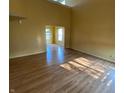 Spacious living room with light-colored walls and lovely laminate floors at 5850 Pennekamp Dr, Plainfield, IN 46168