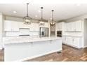 Beautiful kitchen with stainless steel appliances, granite countertops, and a large center island at 6160 Hardwick Dr, Whitestown, IN 46075