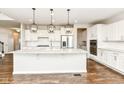 Bright kitchen with stainless steel appliances, granite countertops, and a large center island at 6160 Hardwick Dr, Whitestown, IN 46075