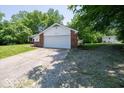 Quaint single Gathering home with a two car garage and expansive driveway surrounded by mature trees at 640 Shady Creek Ct, Greenwood, IN 46142