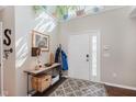Bright foyer featuring a patterned rug, console table, and a well-lit entrance at 7193 Wythe Dr, Noblesville, IN 46062