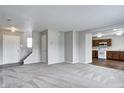 Inviting living space connects to the kitchen, showcasing a modern open-concept layout, fresh paint and new carpet at 8030 Cork Bend Ln, Indianapolis, IN 46239