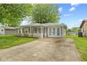 Well-maintained home with stone accents, inviting porch, and spacious concrete driveway at 861 Westbrook Dr, Mooresville, IN 46158
