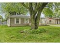 Charming home with well-kept lawn and mature tree providing shade and curb appeal at 861 Westbrook Dr, Mooresville, IN 46158