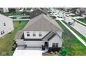 Beautiful aerial view of a home in a suburban neighborhood with lush green lawns and tree-lined streets at 8690 Lester Pl, Pendleton, IN 46064