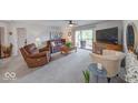 Bright and airy living room with sliding door access to a private outdoor area at 8720 Yardley Ct # 207, Indianapolis, IN 46268