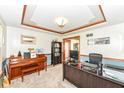 Comfortable office features wood trim and ceiling, and is furnished with a desk and piano at 1031 W Morning Walk Dr, Greenfield, IN 46140