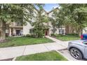 Charming condo exterior with lush landscaping, private balconies, and convenient parking at 1044 Timber Creek Dr # 2, Carmel, IN 46032